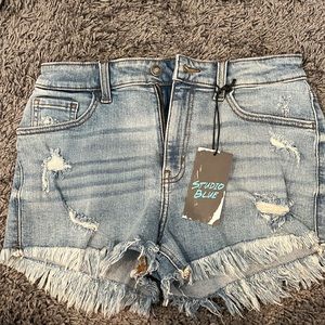 Brand New, Never worn. Size 28 high rise fringe hem shorts.